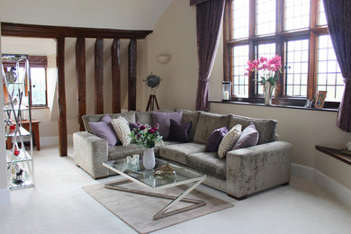 Design ideas for a mid-sized country living room in Hertfordshire with beige walls, carpet and a freestanding tv.