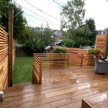 Millboard deck, artificial grass and cedar slat fencing in Reigate