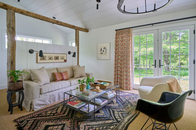 Transitional carpeted, brown floor and shiplap ceiling living room photo in Bridgeport with white walls