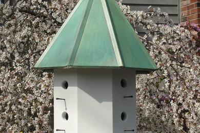 Birdhouses with treated copper roofs