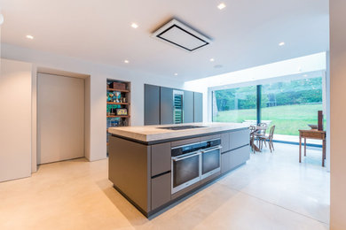 Photo of a modern kitchen in London with with island.