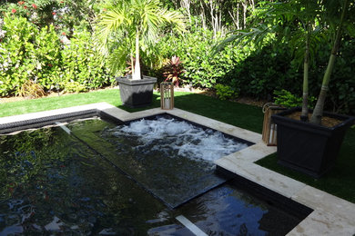Small trendy backyard rectangular natural hot tub photo in Miami