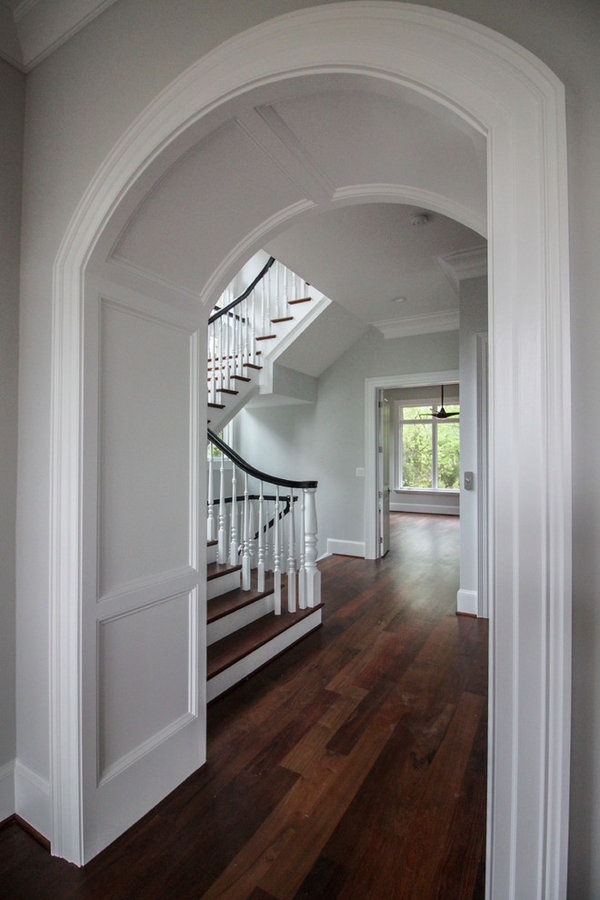 Powerful Impression by Floating Staircase in Suburban Foyer