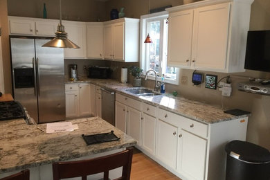 Photo of a kitchen in Other with shaker cabinets.