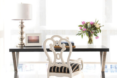 Small trendy freestanding desk light wood floor home office photo in Vancouver with gray walls