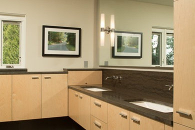 Walk-in shower - large 1950s master brown tile and porcelain tile ceramic tile walk-in shower idea in Portland with an undermount sink, flat-panel cabinets, light wood cabinets, granite countertops, a wall-mount toilet and beige walls