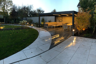 Design ideas for a large contemporary backyard full sun garden for summer in Dublin.