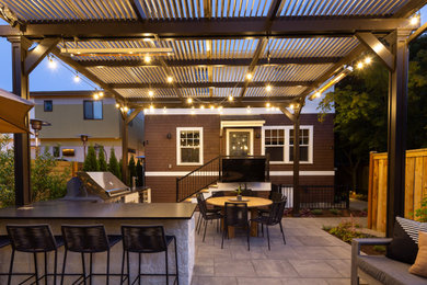 Example of a transitional patio design in Seattle