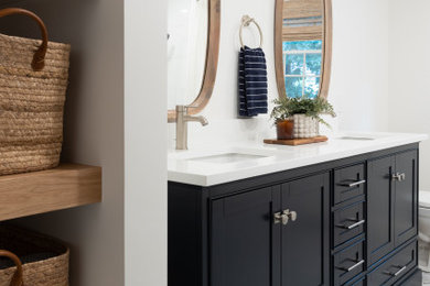 Inspiration for a modern kids' white tile and subway tile porcelain tile, blue floor and double-sink bathroom remodel in Boston with shaker cabinets, blue cabinets, white walls, white countertops, a niche and a freestanding vanity