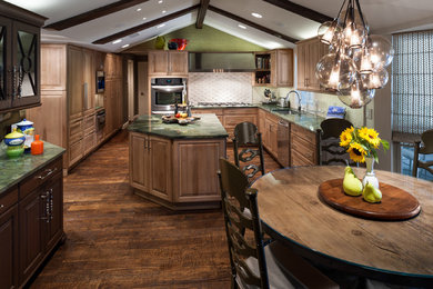 Mid-sized transitional u-shaped medium tone wood floor eat-in kitchen photo in Dallas with an undermount sink, recessed-panel cabinets, light wood cabinets, marble countertops, beige backsplash, stone tile backsplash, stainless steel appliances and an island