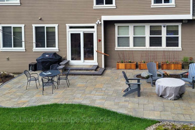 Mid-sized trendy backyard concrete paver patio photo in Portland