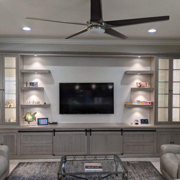 Custom Entertainment Center with Sliding Barn Doors and 6 Floating Shelves