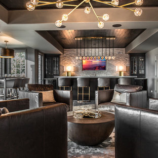 Design ideas for a large contemporary look-out basement in Chicago with grey walls, dark hardwood flooring, no fireplace and grey floors.