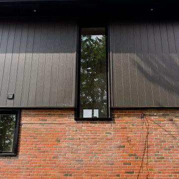 Tall Stairwell Window across Brick and Cladding | Scarborough