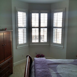 Crestview Shutters using large Deco frame and bi-fold track shutters - Interior Shutters