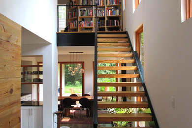 Example of a small urban wooden straight open staircase design in Atlanta