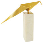 Harp and Finial - Bird Statue II Gold Finish on Metal with White Marble Base - With a gold bird figurine atop a tall white marble base, the Bird Statue II is an intriguing sculpture sure to be the focal point of contemporary decor. The sleek, simple lines of the metal bird are reminiscent of origami, and the metallic gold finish is a stunning counterpoint to the bright white color of the vertical rectangular marble base. This avian tabletop sculpture makes a radiant addition to a family room, living room, or foyer.