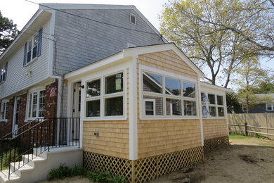 Mid-sized elegant gray two-story mixed siding house exterior photo in Boston with a hip roof