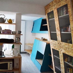 Small scandinavian kitchen pantry designs - Inspiration for a small scandinavian l-shaped linoleum floor kitchen pantry remodel in Bordeaux with a drop-in sink, beaded inset cabinets, light wood cabinets, blue backsplash, white appliances and an island