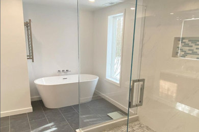 Inspiration for a contemporary gray tile and porcelain tile black floor bathroom remodel with gray walls