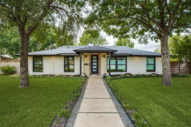 Mid-sized 1950s white one-story brick exterior home idea in Dallas with a shingle roof and a black roof
