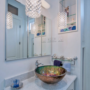 Custom Vanity with Artistic Vessel Sink and Pendant Lighting