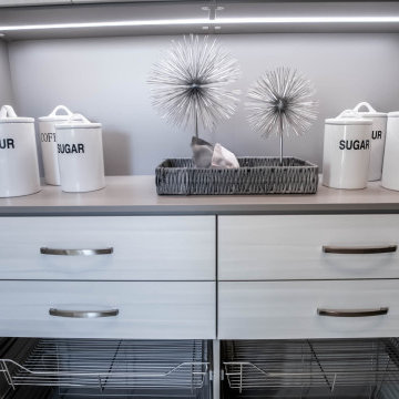 White Drawer Fronts with 3-Inch Holes Handles and Strip Lighting