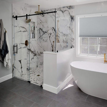 Rolling Shower Door in Modern Bathroom with Freestanding Soaking Tub