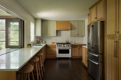 Large transitional u-shaped dark wood floor and brown floor eat-in kitchen photo in Kansas City with an undermount sink, quartz countertops, white backsplash, quartz backsplash, white appliances, white countertops, shaker cabinets and medium tone wood cabinets