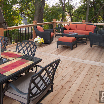 Leeder - Cedar deck in Kansas City with stamped concrete patio and firepit.