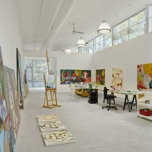 Inspiration for a modern home office and library in New York with concrete flooring.