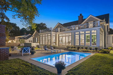 Example of a beach style home design design in Kansas City