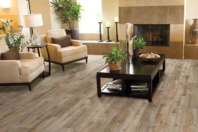 Living room - mid-sized transitional formal and enclosed light wood floor living room idea in Boston with beige walls, a standard fireplace, a tile fireplace and a wall-mounted tv
