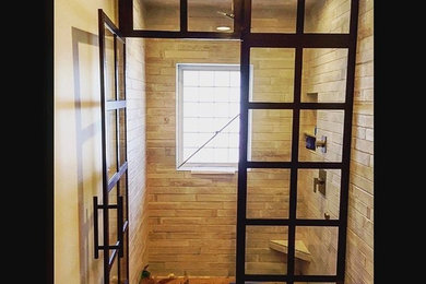 Inspiration for a contemporary bathroom remodel in Omaha with a hinged shower door