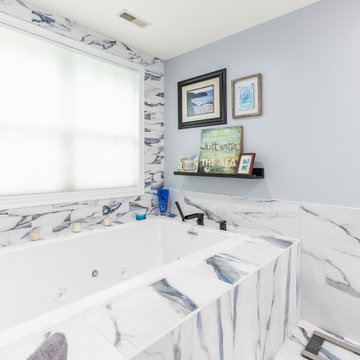 Bathroom remodeling in Columbia, MD with double vanity & marble bathtub
