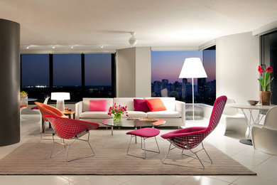 Mid-sized trendy open concept ceramic tile family room photo in Miami with white walls