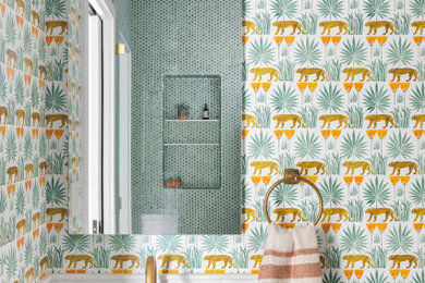 Inspiration for a small kids' green tile and porcelain tile marble floor, white floor, single-sink and wallpaper bathroom remodel in San Francisco with white cabinets, multicolored walls, an integrated sink, a hinged shower door, white countertops, a niche and a built-in vanity