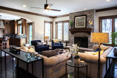 Living room - mid-sized transitional formal dark wood floor and brown floor living room idea in Other with beige walls, a standard fireplace, a stone fireplace and no tv
