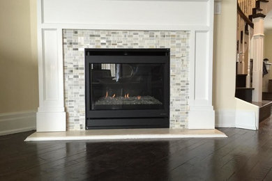 Inspiration for a mid-sized transitional formal laminate floor living room remodel in Toronto with yellow walls, a ribbon fireplace and a tile fireplace