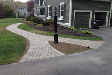Inspiration for a mid-sized traditional full sun front yard concrete paver garden path in Boston.