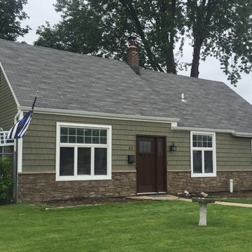 Levittown Siding - Arbor Shakes with Terra Rosa Ledgestone and Mahogany Door