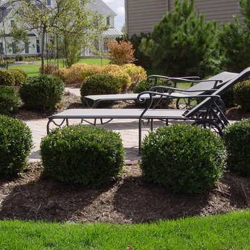 Formal paver patio gardens