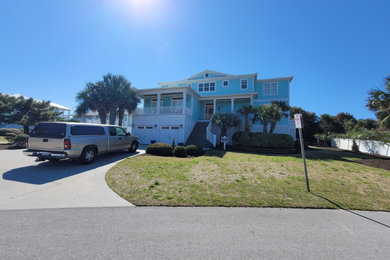 Example of a beach style exterior home design in Other