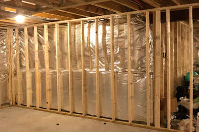 Example of a mid-sized trendy enclosed carpeted and gray floor home theater design in Richmond with blue walls and a projector screen