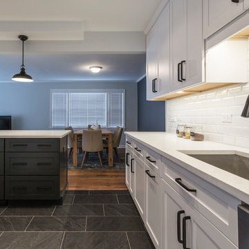 Kitchen Overlooking Dining Area with Black Island