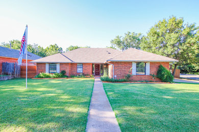 Example of a large minimalist one-story exterior home design in Oklahoma City