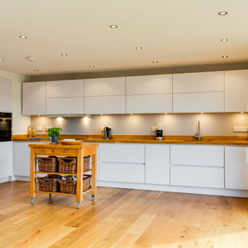 Nobilia White High Gloss Kitchen with Solid wood worktop