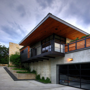 Inspiration for a modern concrete exterior home remodel in Austin