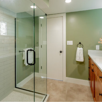 Functional Family Basement Bathroom with Extended Vanity and Sage Green Walls
