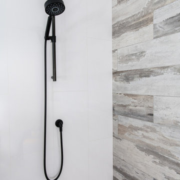 Wall mounted adjustable shower bar and hose